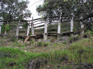Failure of Earth Retaining Wall - Concrete Piers & Wood Lagging