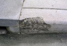 Defective Spalling in Concrete Sidewalk Curb (containing Fly-Ash)-  Building Technology Investigations
